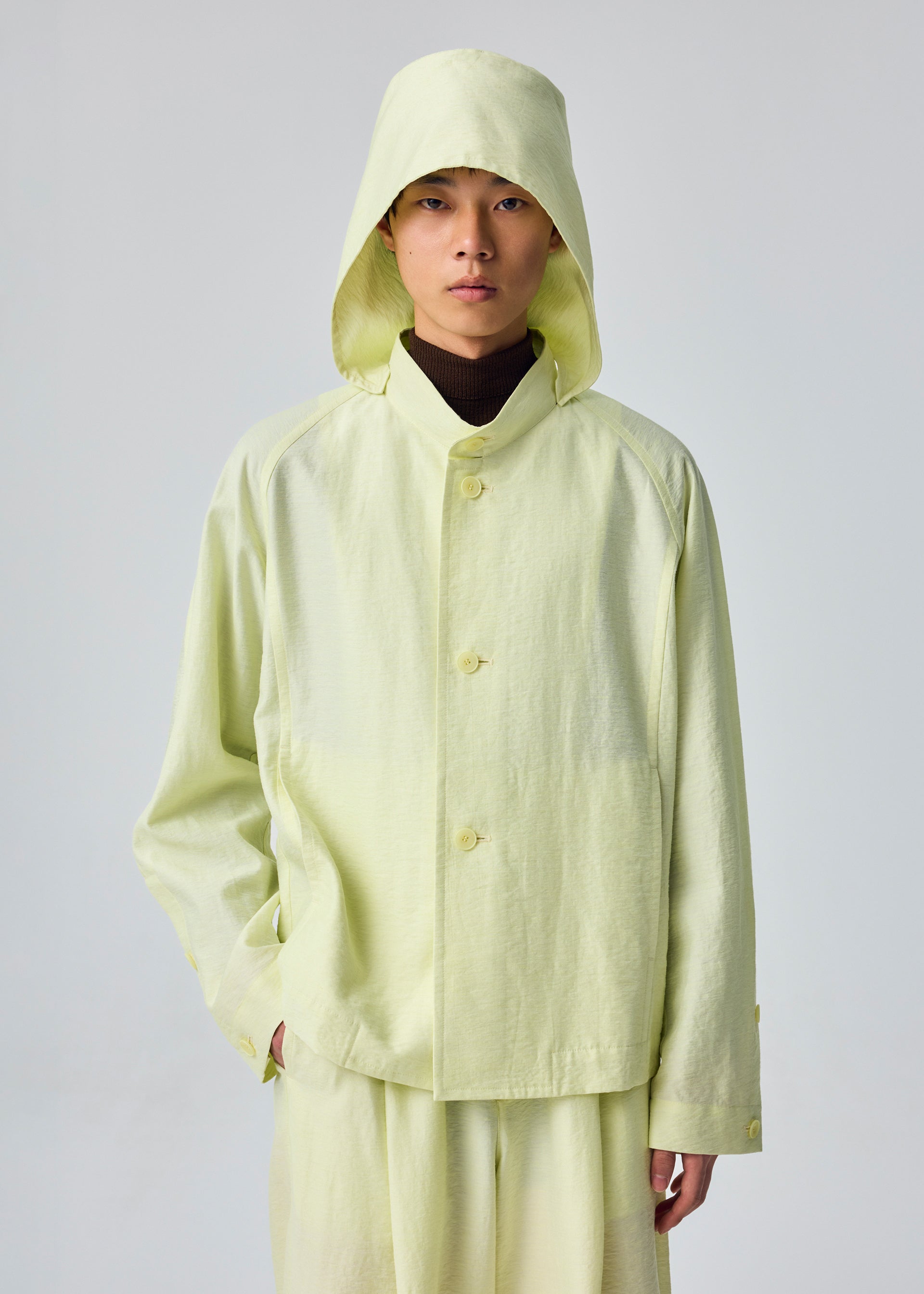 Issey Miyake Opacity bunda s kapucí černá průsvitná