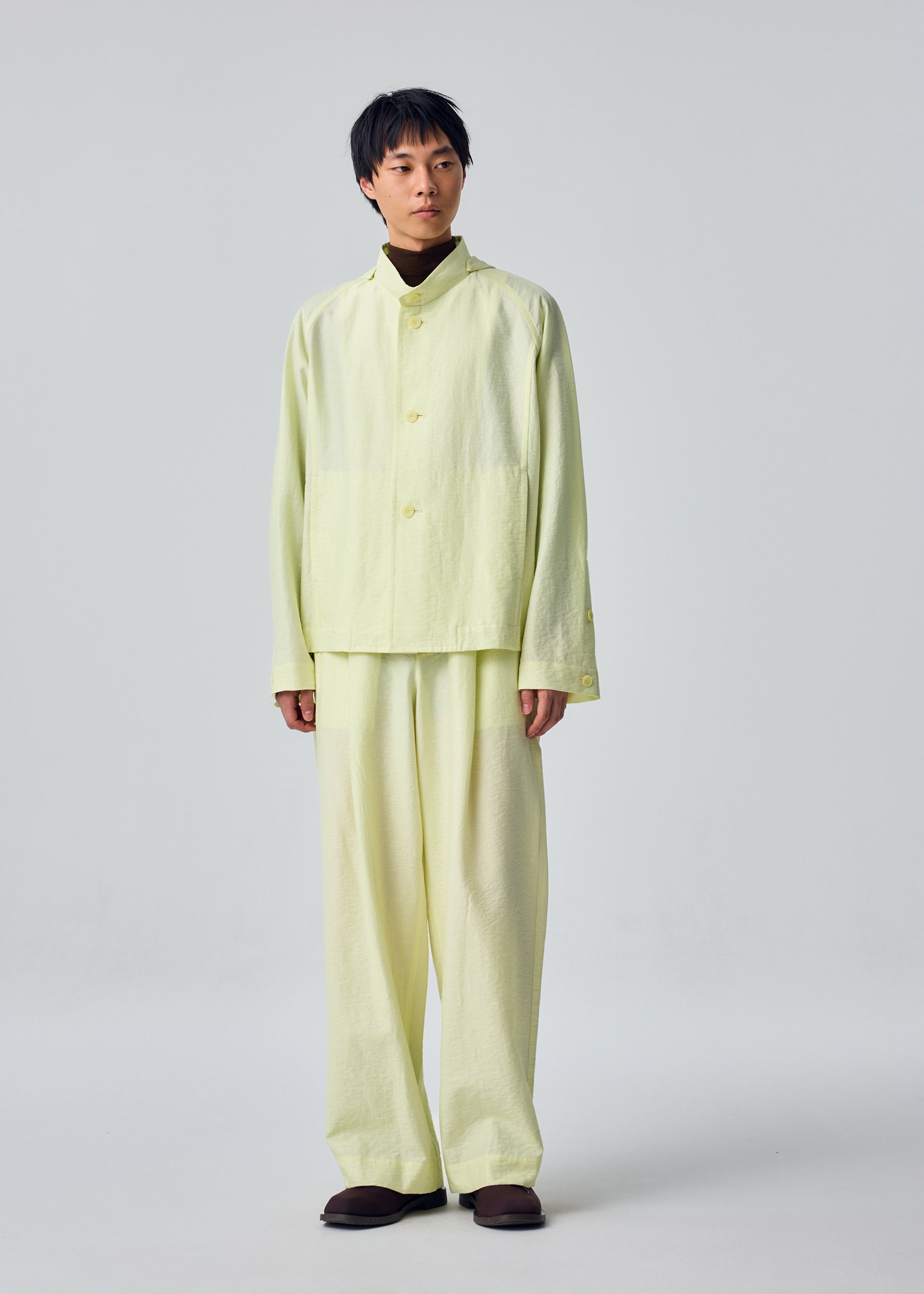 Issey Miyake Opacity bunda s kapucí černá průsvitná