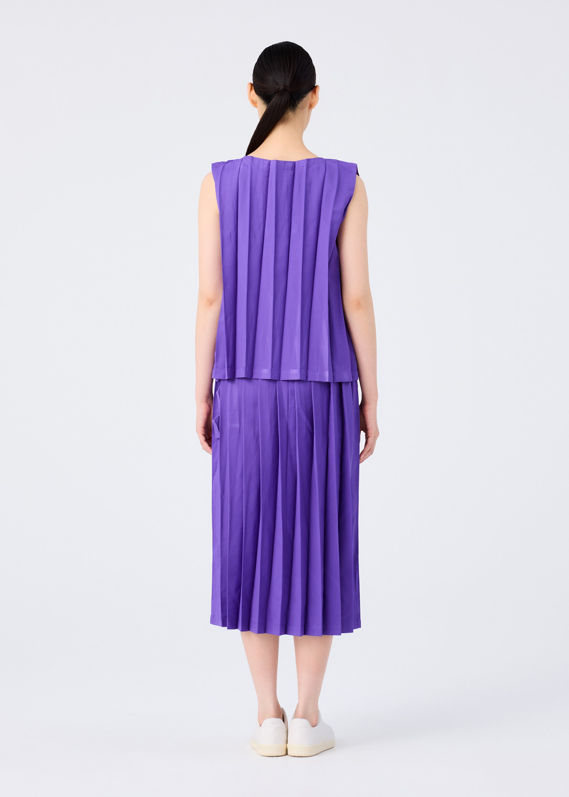 Issey Miyake Cross Pleats sukně černá plisovaná kapsy